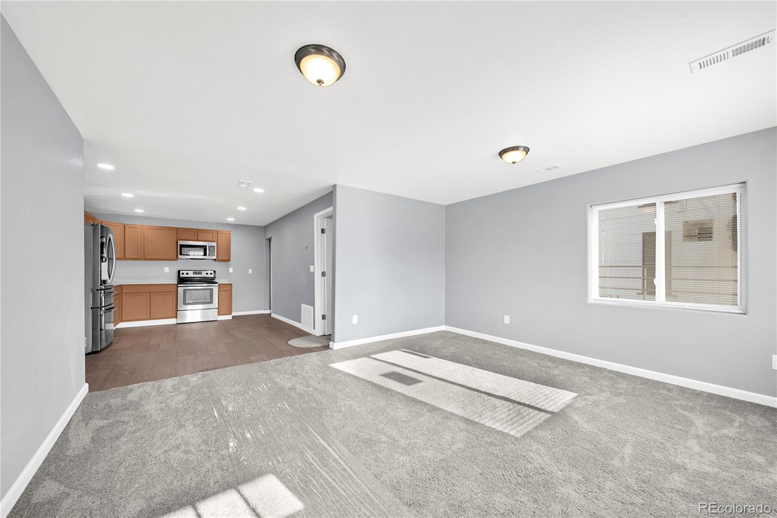 222 Platte Street Sterling, CO 80751 - Photo 4 of 24 a view of an empty room with a window