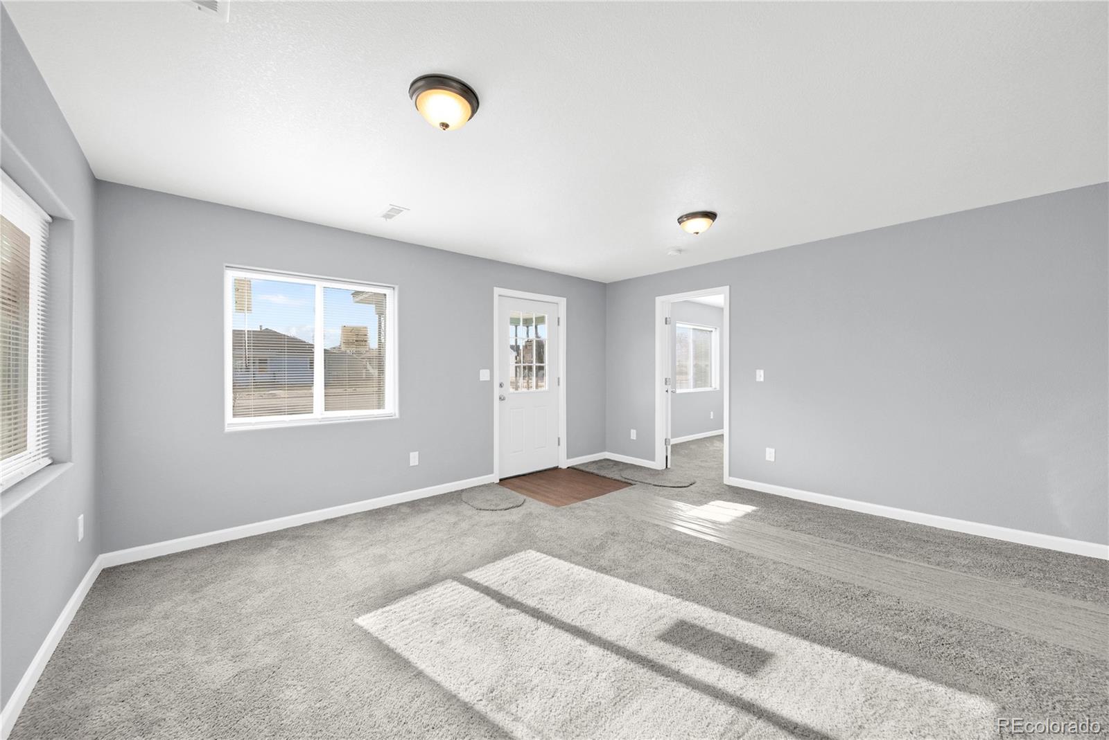 222 Platte Street Sterling, CO 80751 - Photo 6 of 24 a view of an empty room with a window