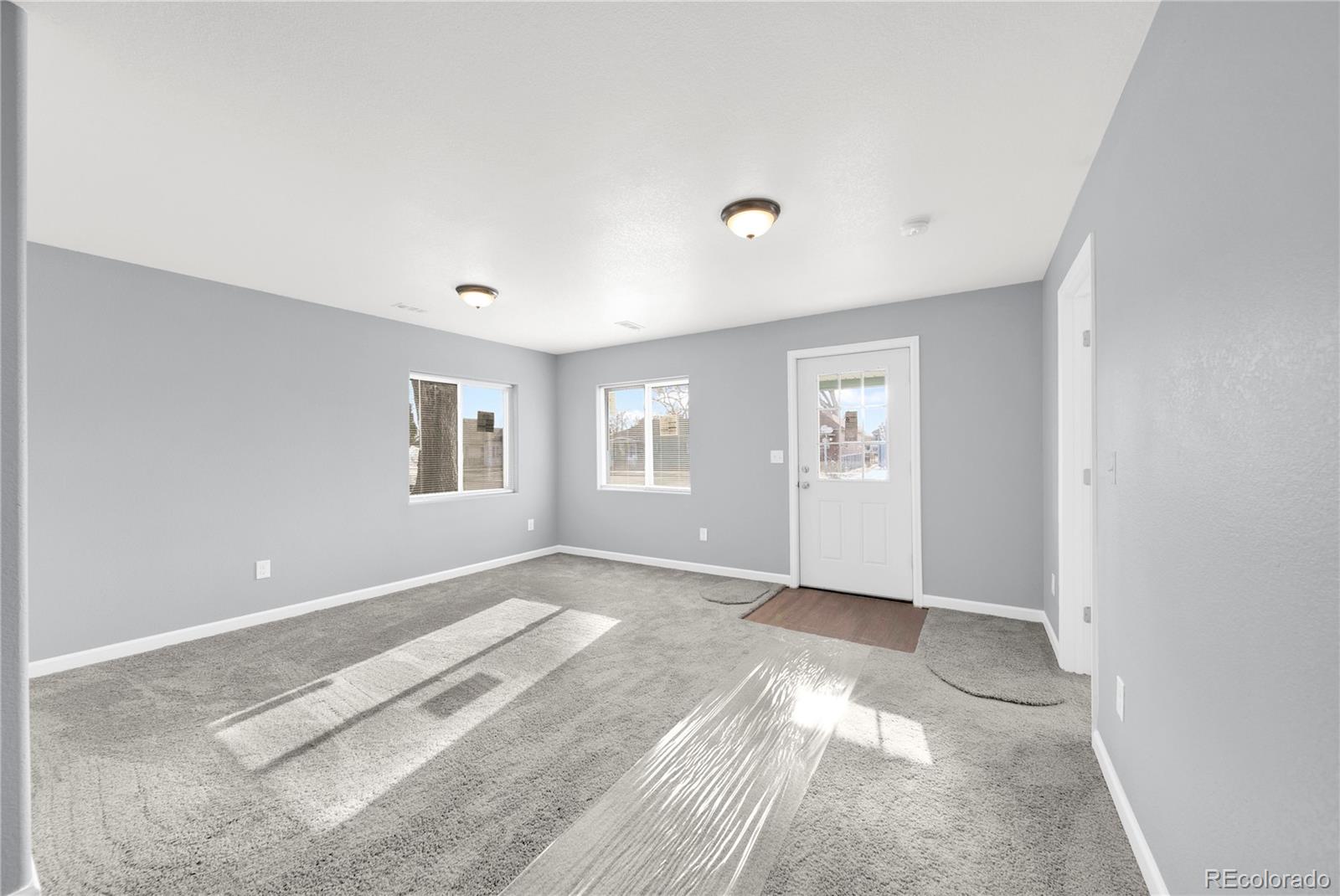 222 Platte Street Sterling, CO 80751 - Photo 7 of 24 a view of livingroom with window
