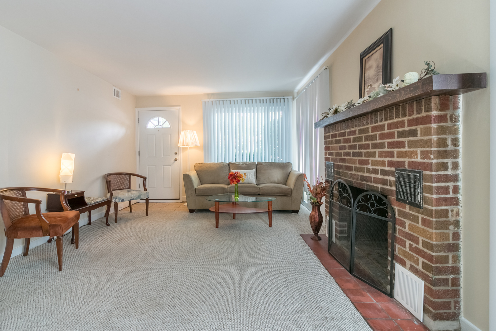 8518 East Prairie Road Skokie, IL 60076 - Photo 2 of 17 a living room with furniture and a fireplace