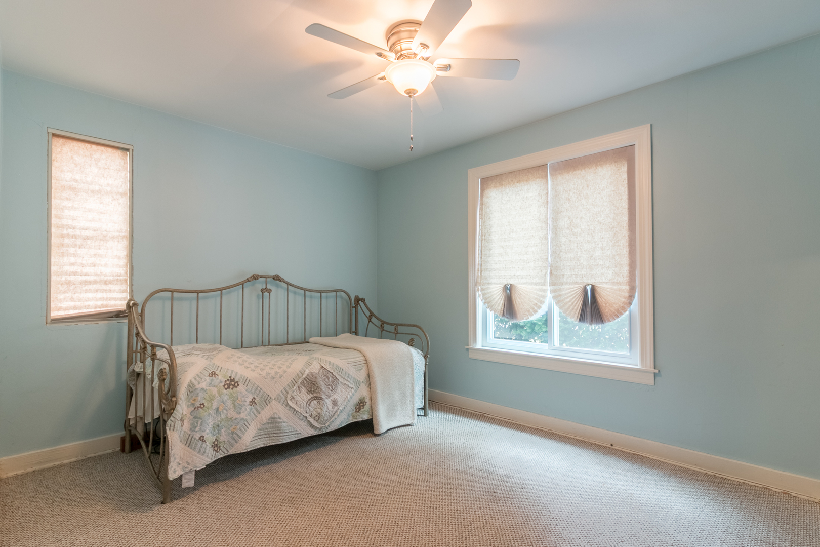 8518 East Prairie Road Skokie, IL 60076 - Photo 13 of 17 a bedroom with a bed and a window