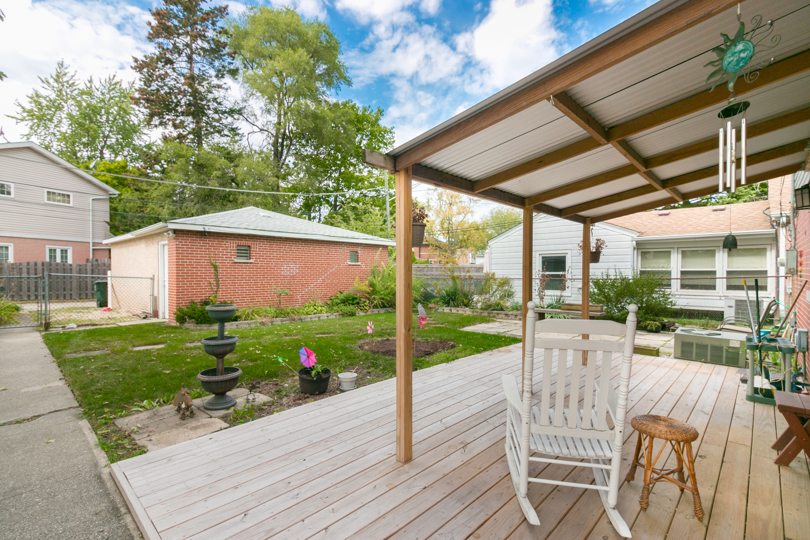 8518 East Prairie Road Skokie, IL 60076 - Photo 16 of 17 a view of a porch with furniture and yard