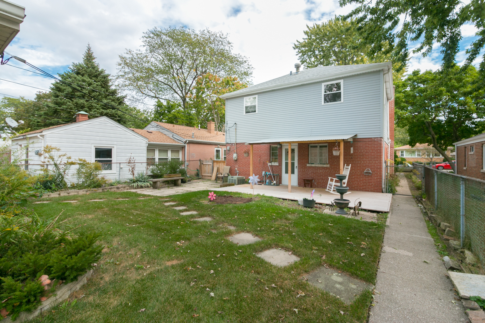 8518 East Prairie Road Skokie, IL 60076 - Photo 17 of 17 a house view with a sitting space garden and patio