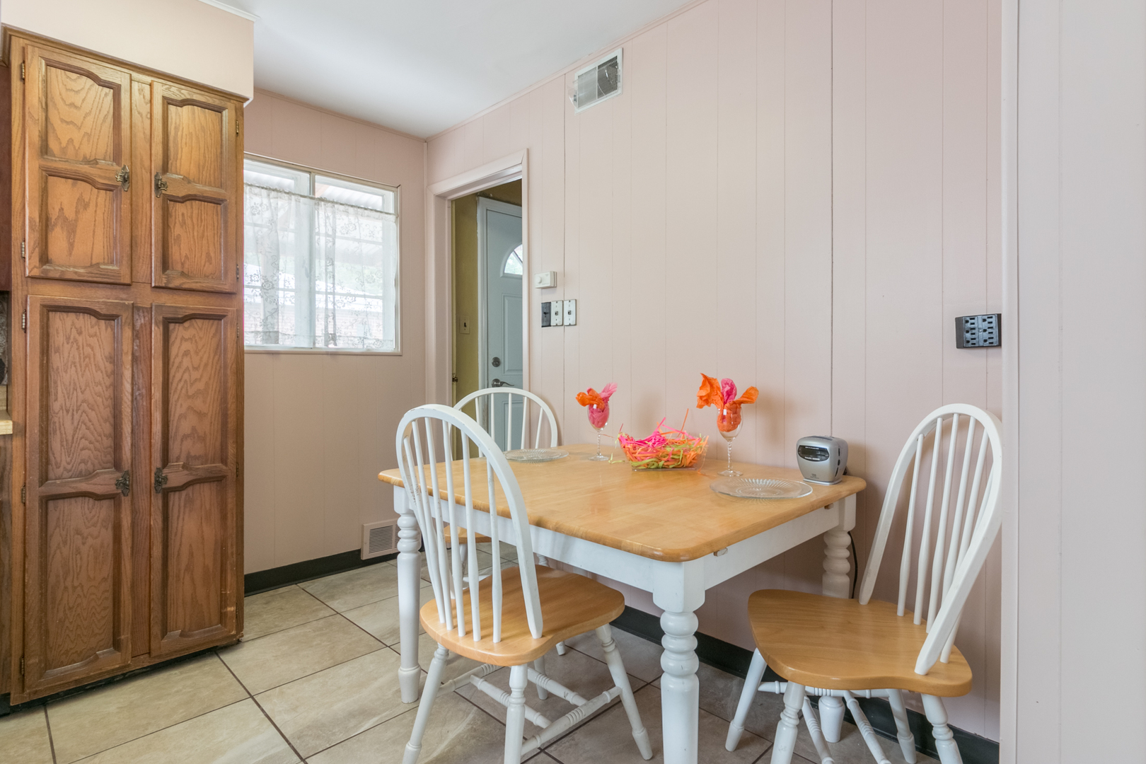 8518 East Prairie Road Skokie, IL 60076 - Photo 6 of 17 a view of a dining room with furniture and window