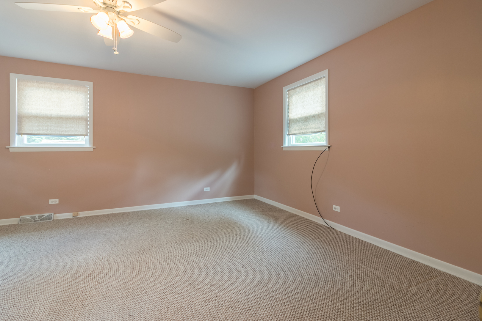 8518 East Prairie Road Skokie, IL 60076 - Photo 7 of 17 an empty room with windows and fan