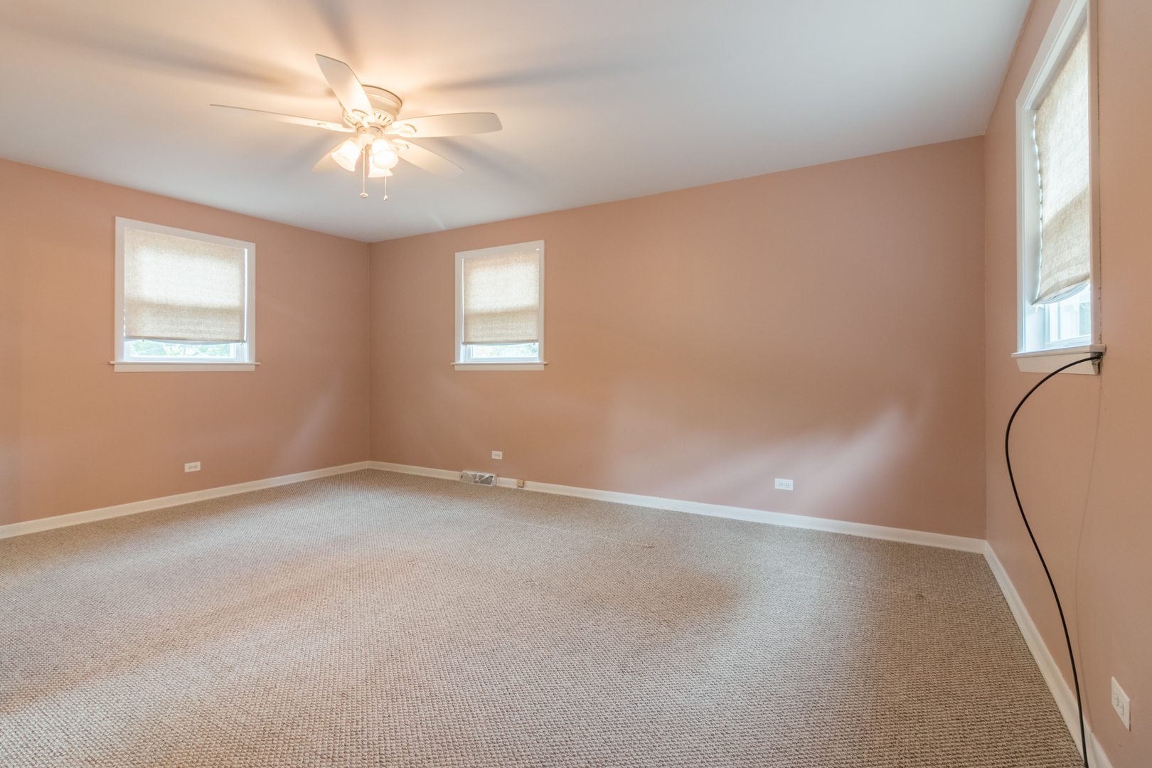8518 East Prairie Road Skokie, IL 60076 - Photo 8 of 17 an empty room with windows and fan