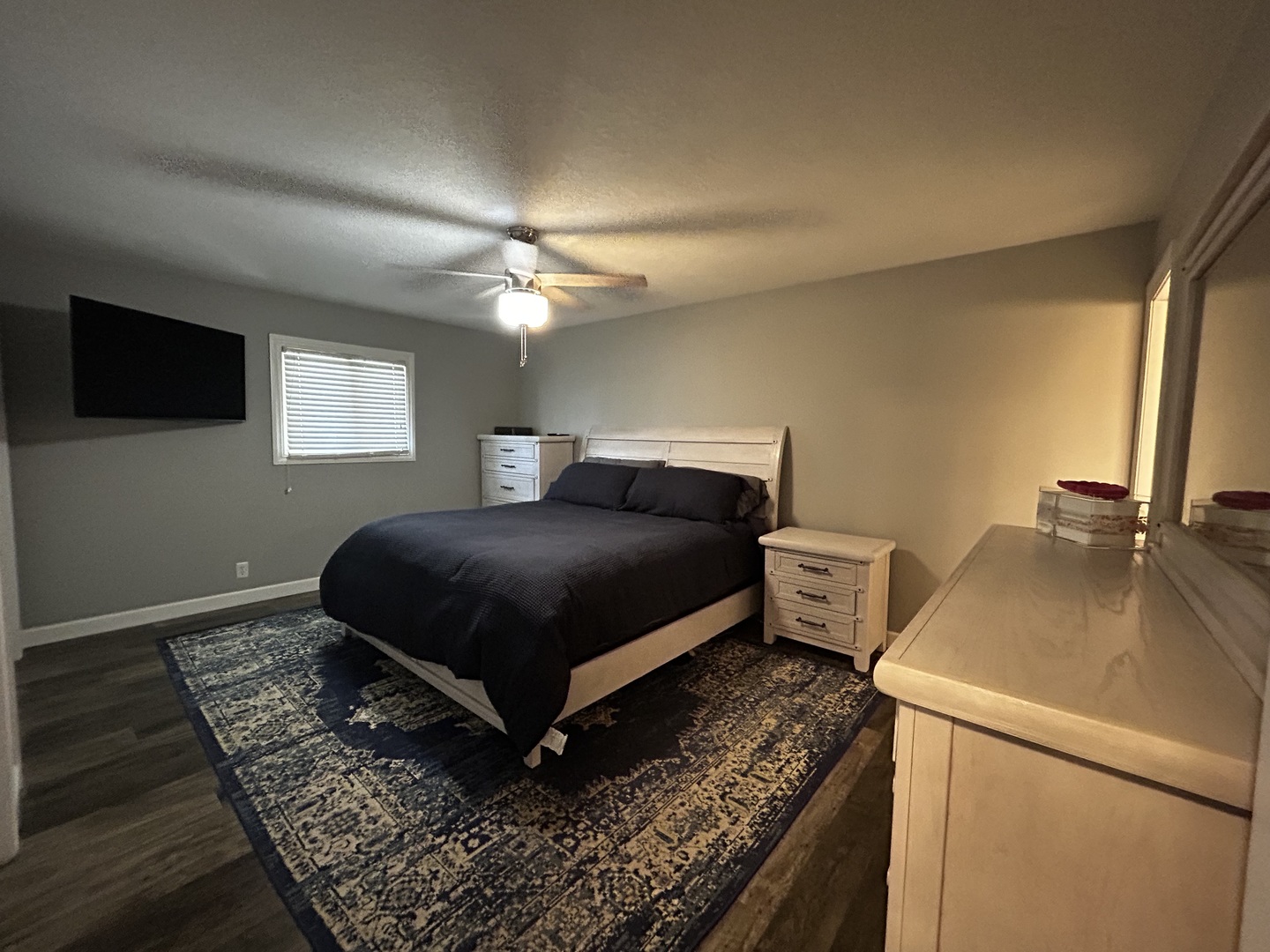 12795 Lawrence Road Sterling, IL 61081 - Photo 23 of 42 a bedroom with a bed and a flat screen tv