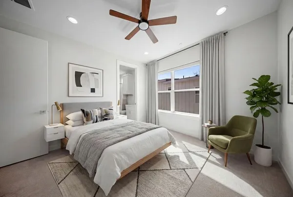 a living room with furniture and kitchen view
