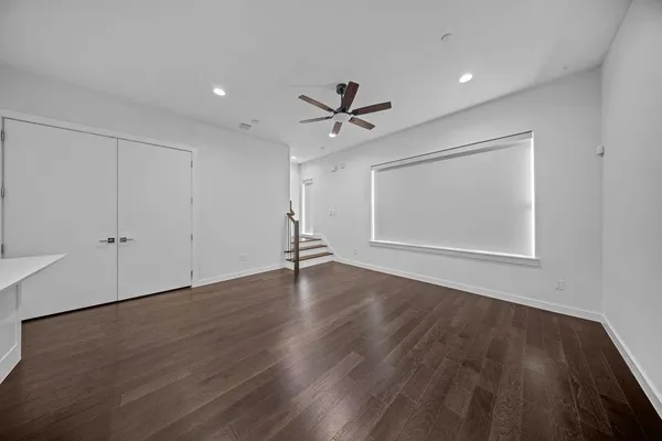a view of kitchen with sink and refrigerator