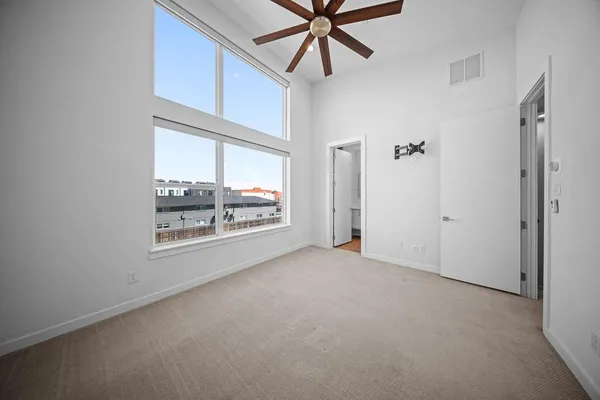 a spacious bathroom with 2 sink and a mirror
