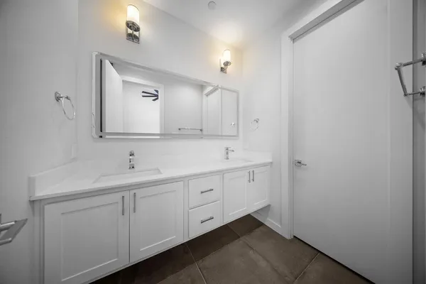 a bathroom with a sink and mirror