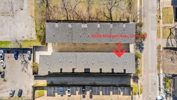 an aerial view of houses with outdoor space