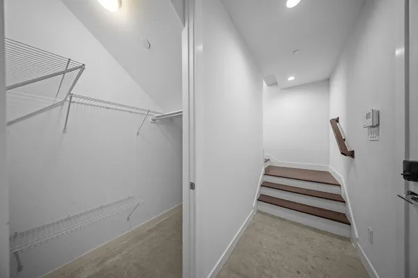 a view of kitchen with wooden floor and electronic appliances
