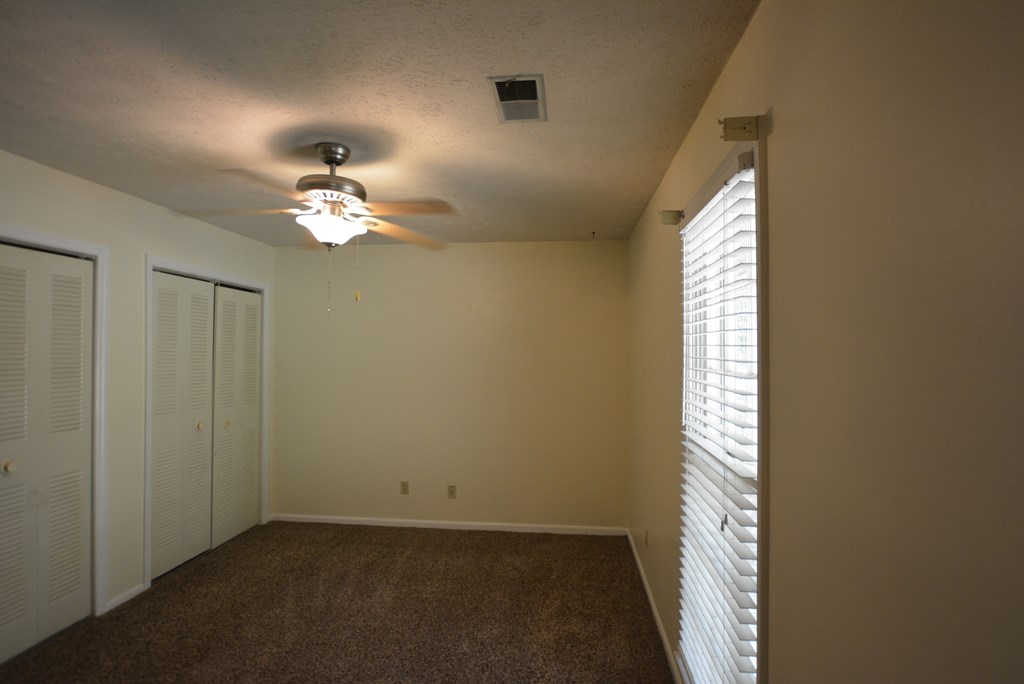 9 Lott Road Phenix City, AL 36869 - Photo 16 of 23 an empty room with chandelier fan