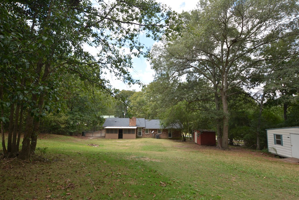 9 Lott Road Phenix City, AL 36869 - Photo 21 of 23 a view of a wooden deck and a trees