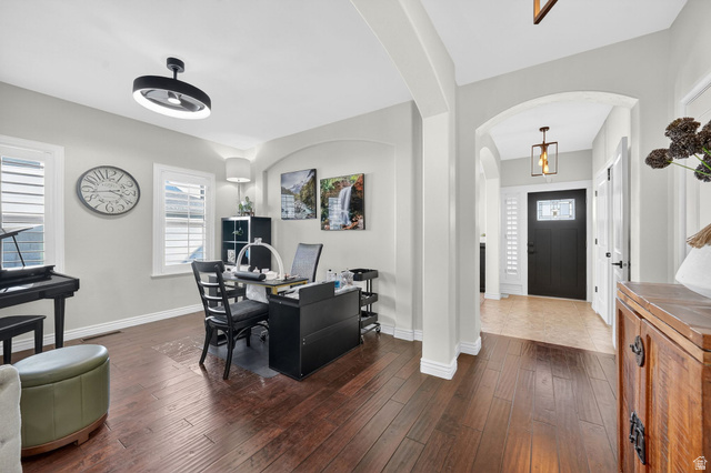 14738 Tangle Hill Road Herriman, UT 84096 - Photo 14 of 66 Rich wood-finish flooring extending through an arched entryway
