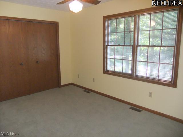4601 Pinewood Path Akron, OH 44321 - Photo 16 of 23 Bedroom 2 offers 2 large windows, ceiling fan and a double closet.