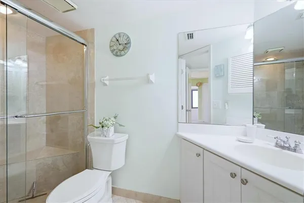 a bathroom with a sink double vanity and a mirror