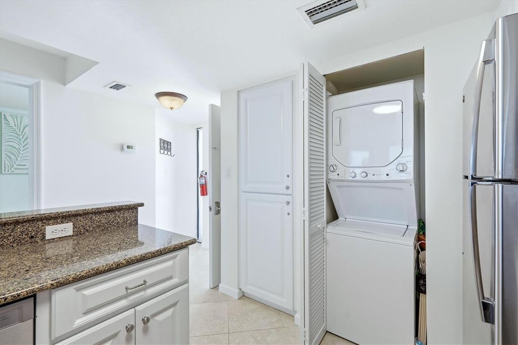 5000 Gasparilla Road, Unit BC205 Boca Grande, FL 33921 - Photo 20 of 50 a en suite bathroom with a granite countertop sink and a mirror