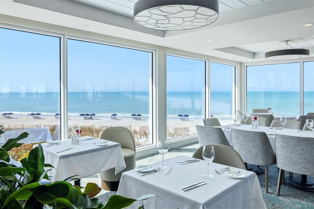 5000 Gasparilla Road, Unit BC205 Boca Grande, FL 33921 - Photo 27 of 50 a view of a dining room with furniture window and outside view