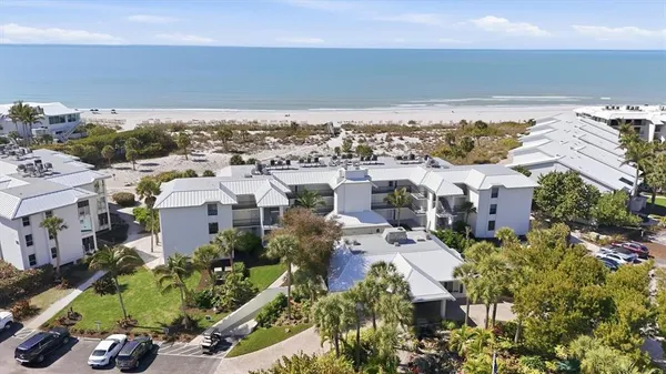 a view of a house with a flower garden
