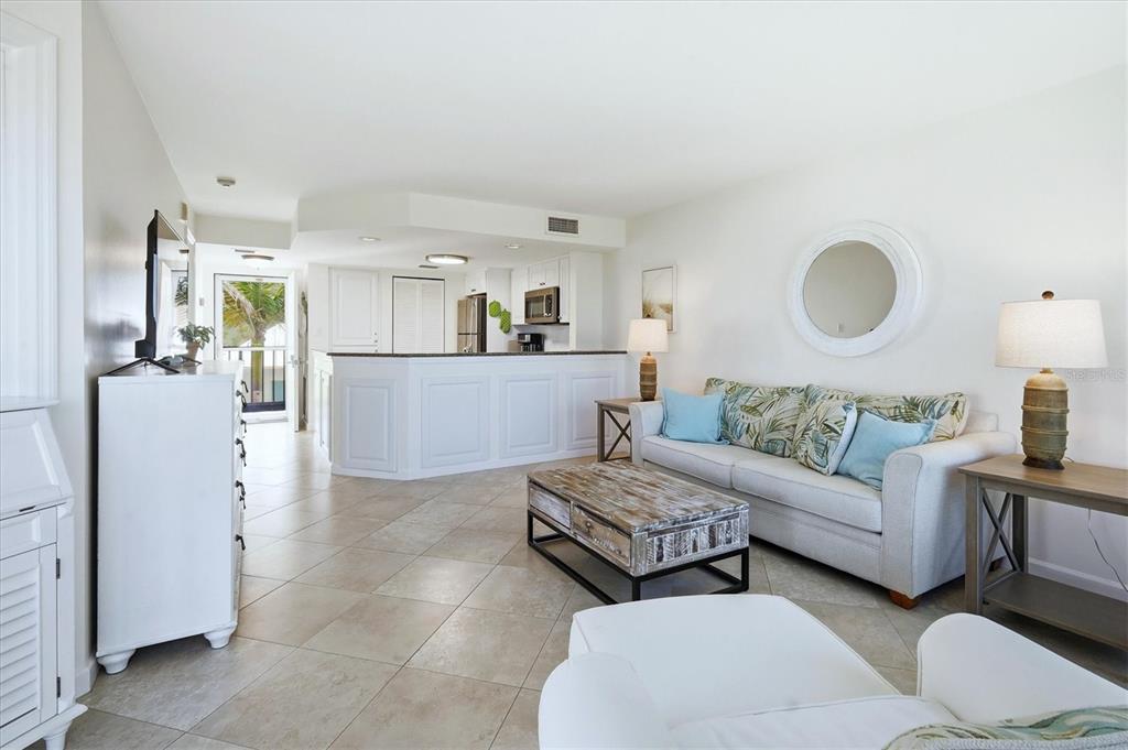 5000 Gasparilla Road, Unit BC205 Boca Grande, FL 33921 - Photo 6 of 50 a living room with furniture and a wooden floor