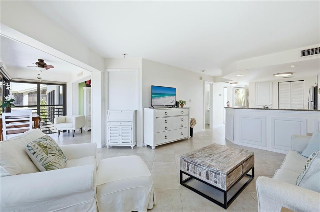 5000 Gasparilla Road, Unit BC205 Boca Grande, FL 33921 - Photo 8 of 50 a living room with furniture and wooden floor