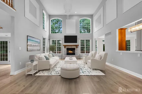 a view of an empty room and a kitchen