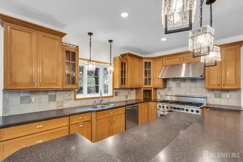 a view of a hallway with wooden floor and windows