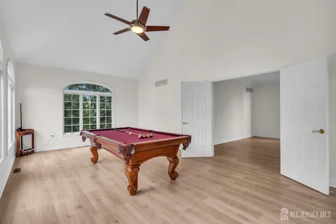 a view of kitchen with kitchen island sink and center island