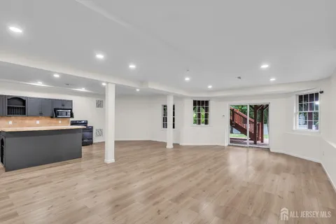 a aerial view of a house with a big yard plants and large trees