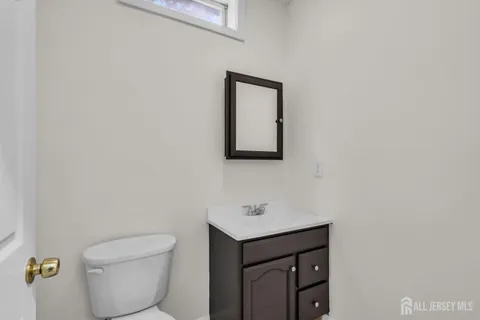 an aerial view of a house with garden space and street view