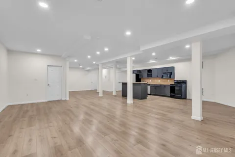 an aerial view of a house with garden space and street view