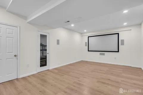 an aerial view of a house with a swimming pool and garden