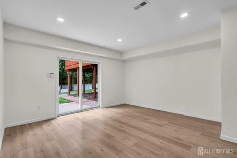 an aerial view of a house with a swimming pool and outdoor space