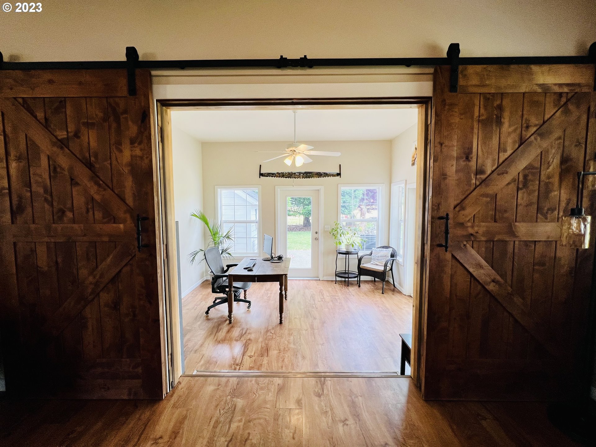 5393 Nonpareil Road Sutherlin, OR 97479 - Photo 16 of 42 a view of a hallway with wooden floor and furniture