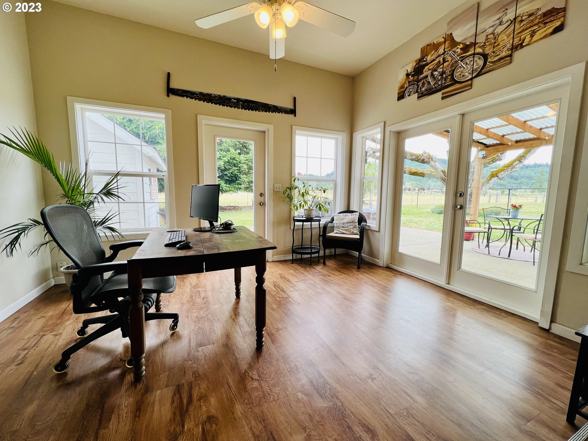 5393 Nonpareil Road Sutherlin, OR 97479 - Photo 17 of 42 a view of a workspace with furniture and a window