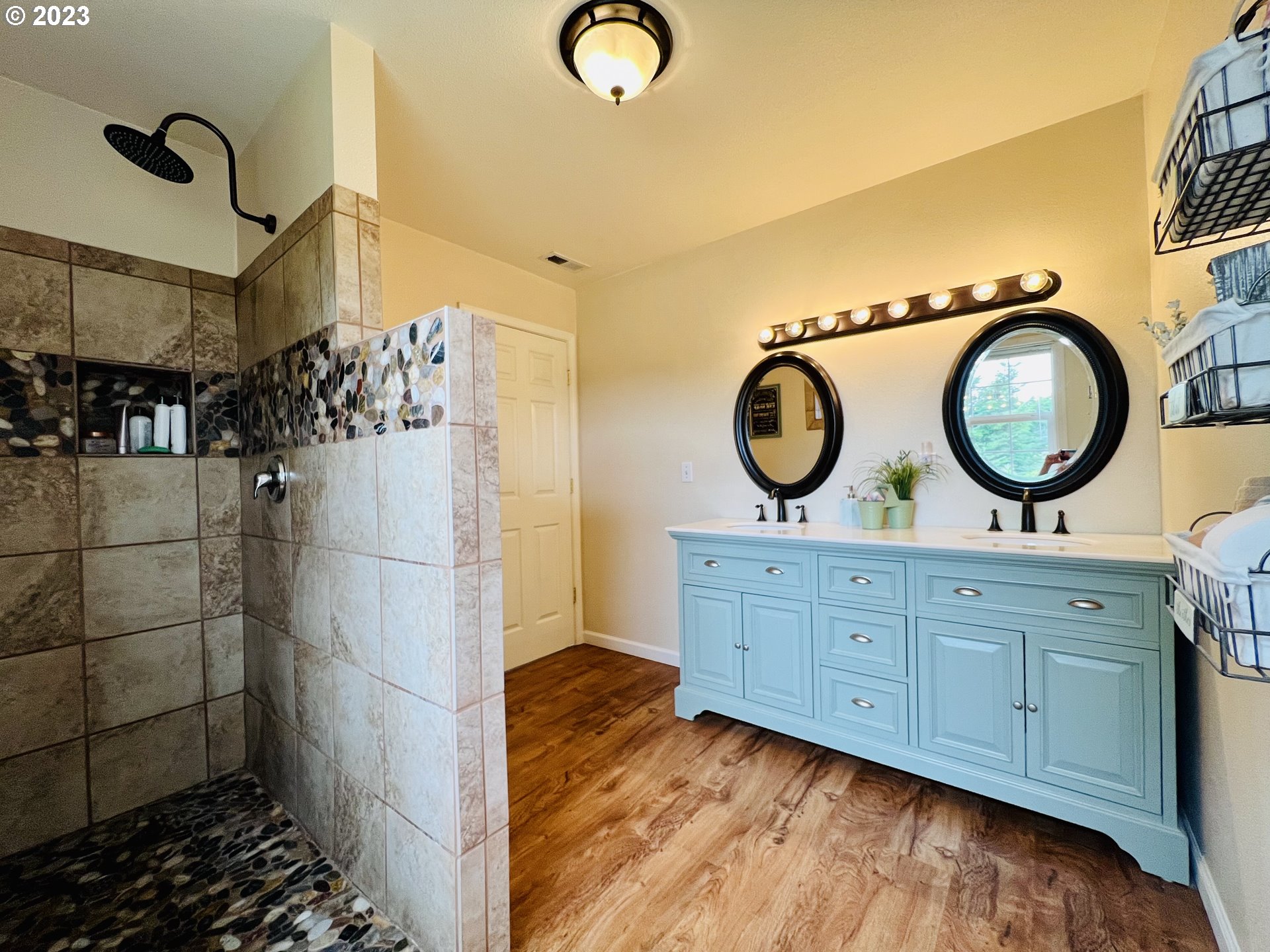 5393 Nonpareil Road Sutherlin, OR 97479 - Photo 20 of 42 a view of a bathroom with a sink and a mirror