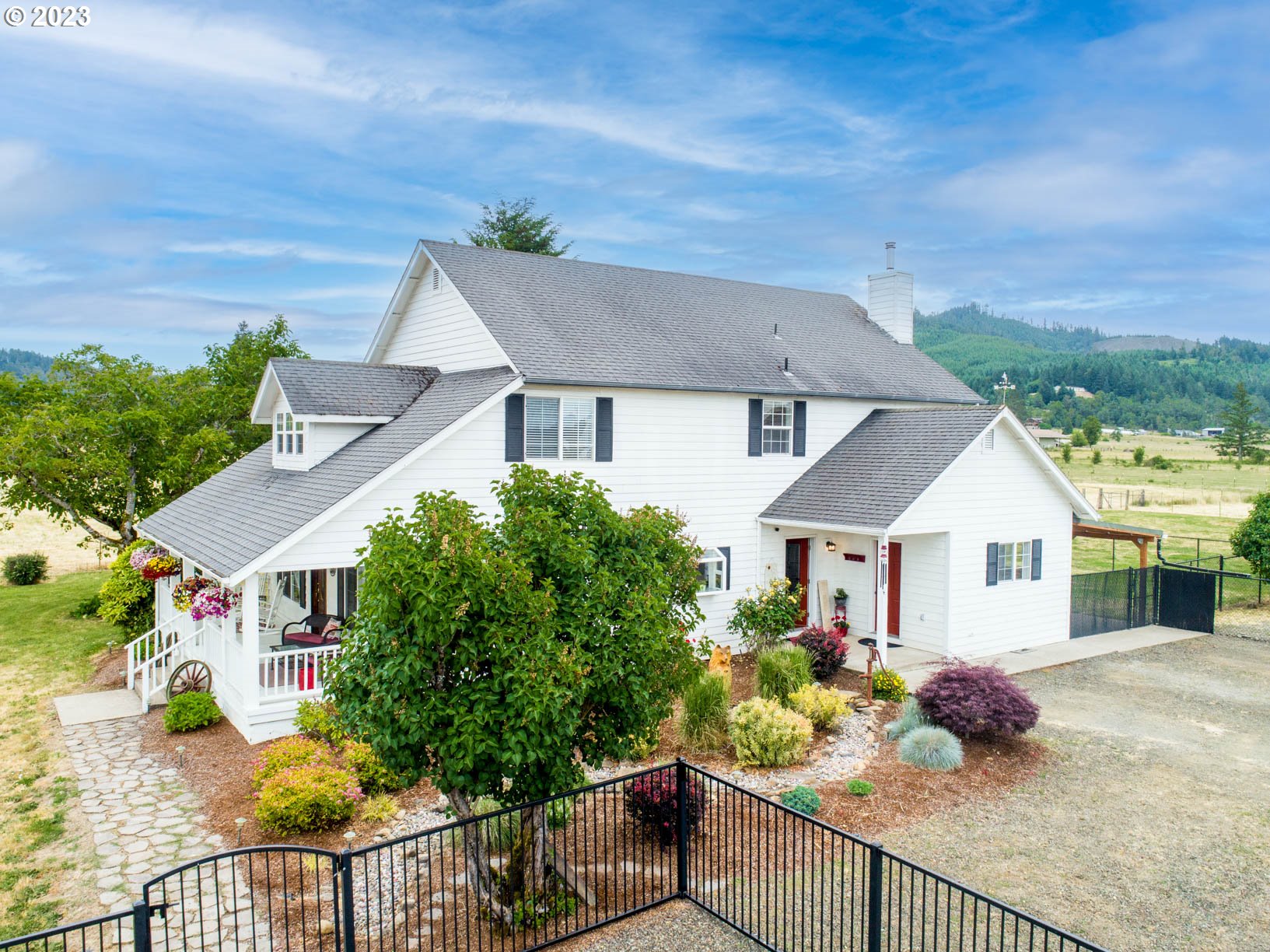5393 Nonpareil Road Sutherlin, OR 97479 - Photo 2 of 42 front view of a house with a chairs
