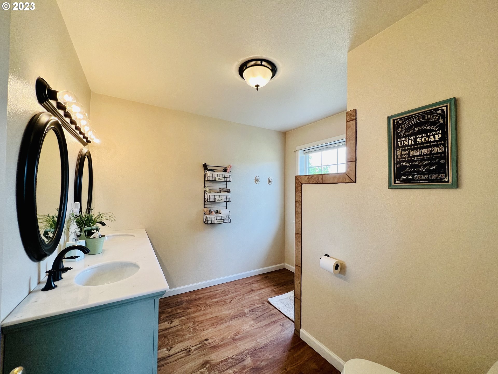 5393 Nonpareil Road Sutherlin, OR 97479 - Photo 21 of 42 a bathroom with a sink a mirror and shower