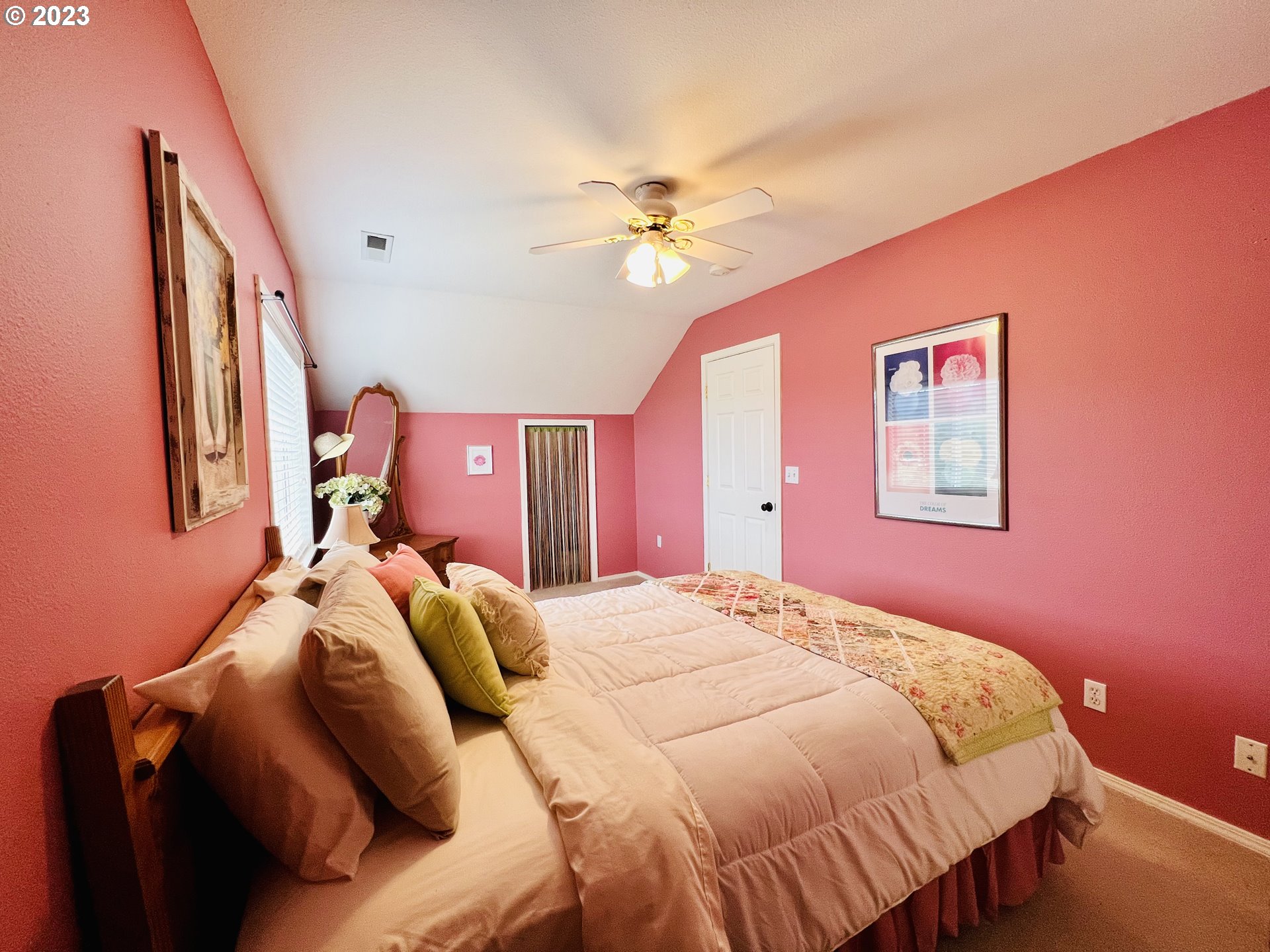 5393 Nonpareil Road Sutherlin, OR 97479 - Photo 24 of 42 a bedroom with a bed and a chandelier