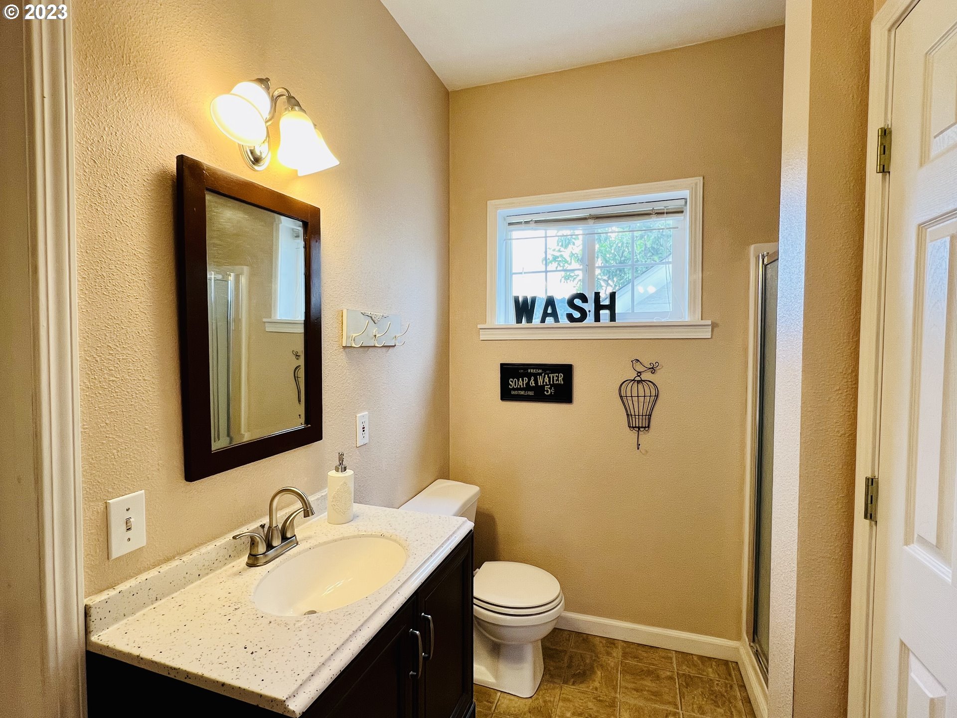 5393 Nonpareil Road Sutherlin, OR 97479 - Photo 29 of 42 a bathroom with a sink mirror vanity and toilet