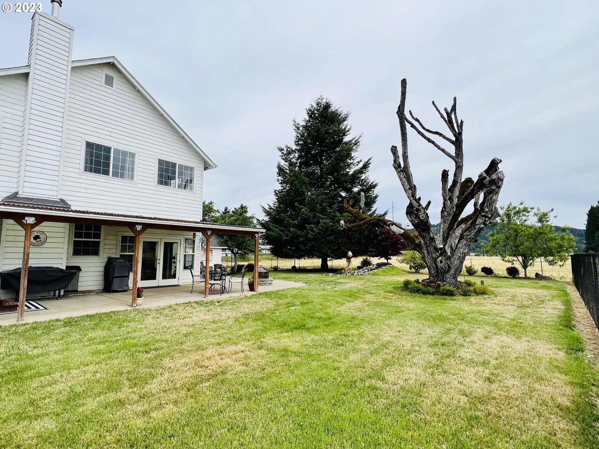 5393 Nonpareil Road Sutherlin, OR 97479 - Photo 32 of 42 a view of a house with backyard porch and sitting area
