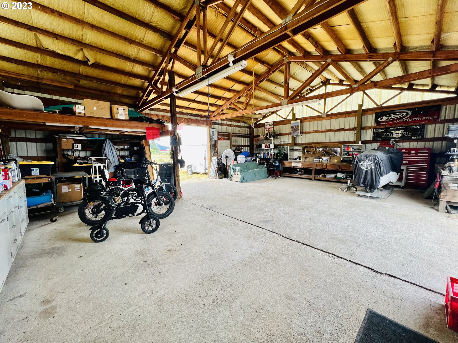 5393 Nonpareil Road Sutherlin, OR 97479 - Photo 37 of 42 a view of a garage with a bike and car