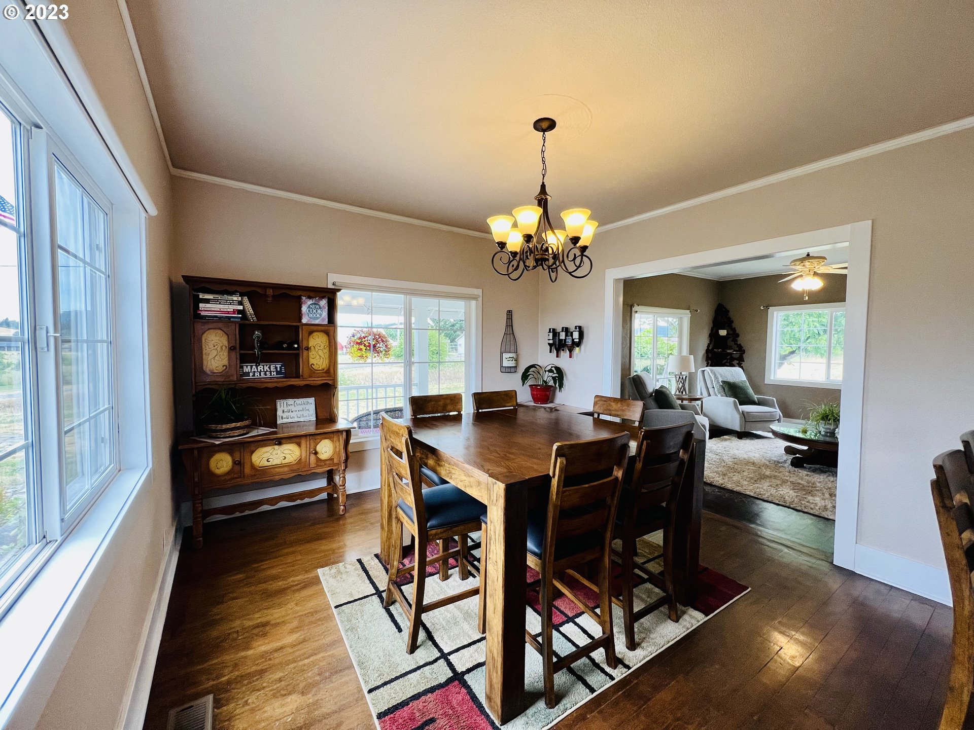 5393 Nonpareil Road Sutherlin, OR 97479 - Photo 9 of 42 a view of a dining room with furniture and a chandelier