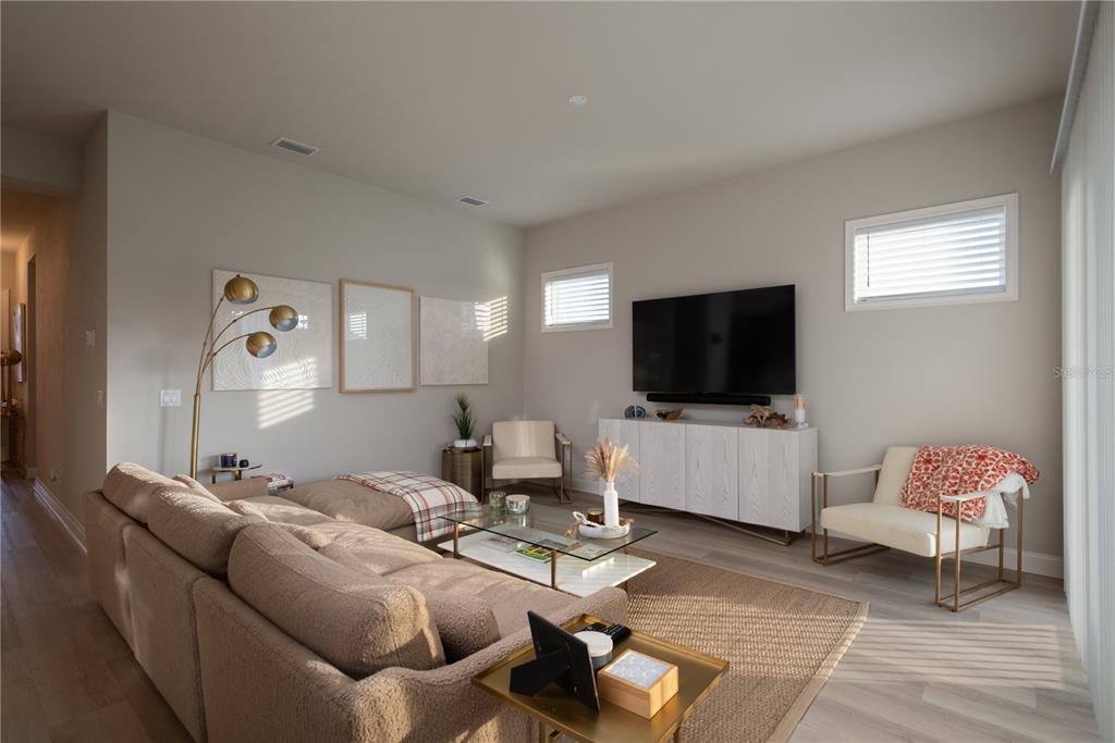 3350 Southwest 120th Terrace Gainesville, FL 32608 - Photo 6 of 32 a living room with furniture and a flat screen tv