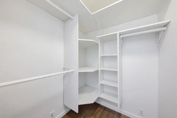 a view of an empty walk in closet