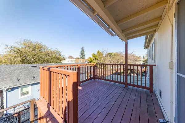 a balcony with wooden floor