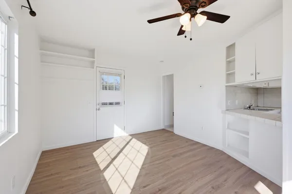 a bedroom with a bed and cabinets