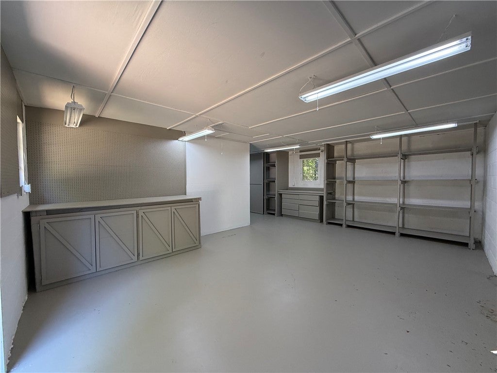 306 Crawford Road Opelika, AL 36804 - Photo 27 of 31 This spacious garage offers abundant storage solutions and versatile utility space.